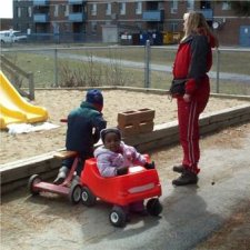 Children in a red cart.