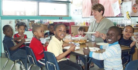 Children at another table enjoying a snack.